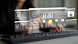 © InfiniteFlow - A digital interface showcasing artificial intelligence features and data analytics, with a focused professional working on a keyboard in a modern workspace environment. Gantry