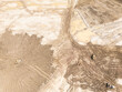 © contentzilla - Aerial view of a large construction site showing earthmoving equipment working on a vast area of disturbed ground. With piles of dirt. Muddy puddles. And numerous tracks indicating ongoing development