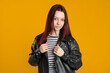 © New Africa - Woman with color dyed hair on orange background