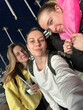 © Asya Molochkova/Stocksy - Group of Friends Taking a Sunny Travel Selfie at the Airport