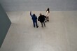 © Studio Sincère/Stocksy - Three people exploring modern apartment in urban setting