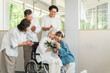 © buritora - Three-generation family visiting a nursing home (presents, bouquet, Respect for the Aged Day)