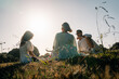 © Maria Sher/Stocksy - Friends Enjoying a Sunny Afternoon Picnic in the Park