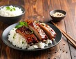 © Ahmad - Delicious Asian-style glazed ribs served with fluffy white rice and garnished with fresh herbs.