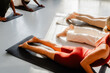 © Nuria Seguí/Stocksy - Goup of anonymous people doing yoga