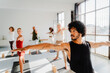 © Nuria Seguí/Stocksy - A group of individuals practicing yoga