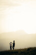 © Nsikanabasi Effiong/Stocksy - Two Friends Exploring The Mountains.