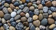 © dawet - Close-up Texture of Smooth Polished River Stones in Various Colors and Patterns.