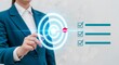 © Alice - Businesswoman hitting target with checklist achieving goals and success in corporate strategy
