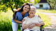 © Halfpoint - Home nurse taking care of elderly woman in wheelchair.