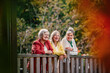 © Halfpoint - Portrait of three smiling senior women together outdoors.