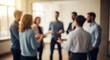 © MdAhsanul - A group of diverse business professionals standing in a circle and communicating effectively