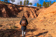 © unai - Woman hiking red clay canyon in las arcillas natural park