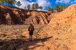 © unai - Woman hiking in las arcillas natural park exploring red clay canyon