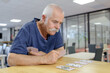 © auremar - senior playing cards in the retirement house