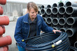 © auremar - female worker dealing with pipes