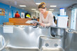 © auremar - female looking at jacuzzi bathtub at store