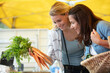 © auremar - female friends shopping at food market