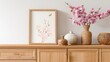 © Ferman Bagus Istuhri - Elegant floral arrangement with artwork on wooden cabinet against white wall