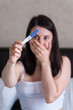 © phpetrunina14 - Surprised Woman with Positive Pregnancy Test