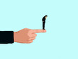 © Westend61 - Businessman standing on pointing finger illustrating doubt and risk
