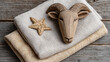 © Ruzana - Carved wooden ram head and star on linen fabric - nordic pagan winter holidays decor