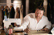 © caftor - Man carries out leading online tailor training