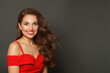 © artmim - Cute brunette woman with trendy make-up and brown curly hair wavy hairstyle and red lips makeup on black background
