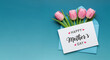 © mraual24 - Pink tulips and heartfelt greeting card express beautiful wishes for happy mother's day celebration