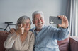 © Daniel - A happy senior couple takes a selfie together, smiling and hugging while looking at the camera, capturing a joyful moment of love and companionship in a warm lifestyle portrait