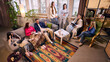 © master1305 - Comfortable office team meeting in cozy loft workspace. Concept of relaxed internal planning session, flexible seating arrangement and supportive work environment for modern startup.