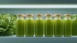 © CYBERPINK - Row of six glass bottles with wooden lids lined up on a white shelf. the bottles are filled with a green liquid, which appears to be a smoothie or juice.