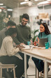 © Zamrznuti tonovi - Diverse professional team collaborating during office meeting