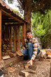 © Alba Vitta Studio/Stocksy - Man Stacking Firewood Logs