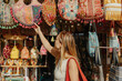 © Satya Gautam/Stocksy - Exploring Colorful Bags at a Vibrant Market in the Afternoon Sun