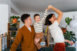 © Nuria Seguí/Stocksy - Parents entertain their son at home