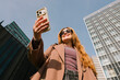 © Lightsy/Stocksy - Woman using phone