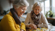 © Kateryna - Two faceless senior women friends playing leisure board game at home elderly recreation social activity tabletop gaming retirement lifestyle natural lighting defocused home