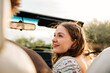 © Natalie Wheeler - Close up of a young girl smiling in convertible