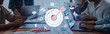 © InfiniteFlow - A group of professionals collaborates on strategic planning in a modern office. Digital tools enhance teamwork and focus on achieving goals in an innovative environment. Trope