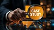 © Ridwan_DigitalGrid - Businessman examining case study with magnifying glass in modern office
