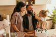 © La Famiglia - Happy family enjoying a birthday celebration at home