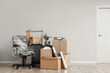 © Pixel-Shot - Wrapped furniture with stretch film and moving boxes in office