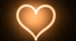 © sea sae - A glowing neon heart shape illuminated against a darkened background, symbolizing love