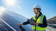 © M - Japanese female engineer inspecting solar panels on rooftop with digital tablet（屋上でデジタルタブレットを使ってソーラーパネルを検査する日本人女性エンジニア）