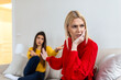 © Graphicroyalty - Two women having an argument on the sofa. Young female ignoring her friend after a conflict. Relationship problems, friendship crisis, social distance and communication difficulties concept.