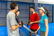 © unai - Friends laughing and talking after playing pickleball