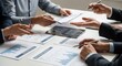 © MUGU STD - Business team analyzing financial reports and data