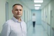 © Tatiana - Medical professional standing in a hospital hallway