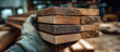© oswasa - hand holding stacked lumber planks